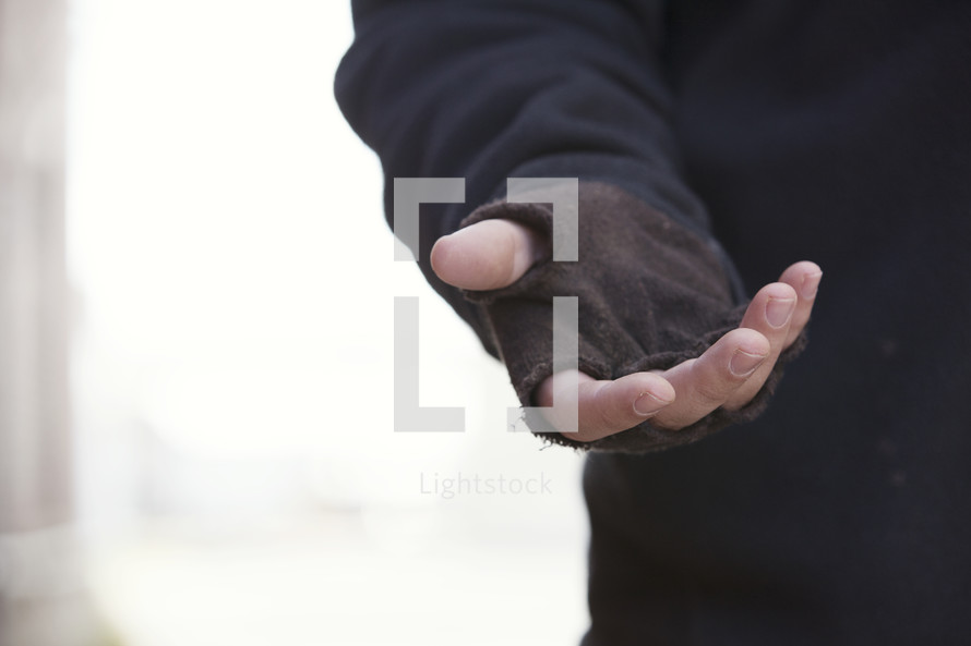 beggar with outstretched hand