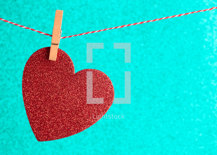 red heart cutout on a clothesline 