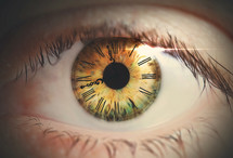 An eye with a clock face on the iris.