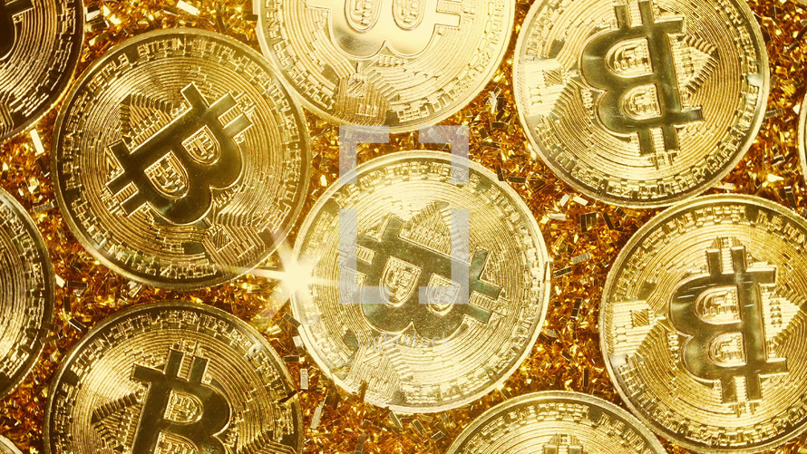 Bitcoin, crypto currency. Golden coins. Digital exchange, popularity of BTC, symbol of future money, electronics industry, mining concept. High quality photo