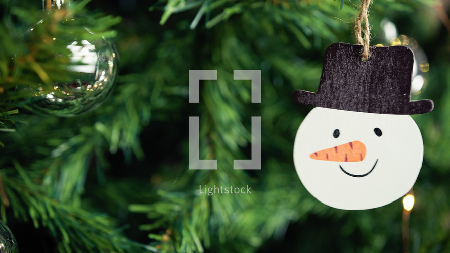 Snowman decoration on a Christmas tree