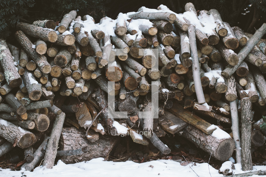 wood pile in snow 