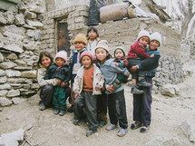 children in winter hats with red rosy cheeks