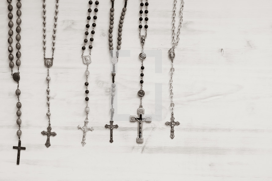 rosaries on a black background 