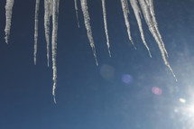 icicles against a blue sky 