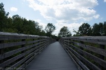 Wooden bridge with rails.