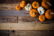 pumpkins on wood boards 