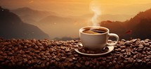 Coffee cup and coffee beans on the background of mountains.