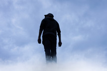 man silhouette in the clouds