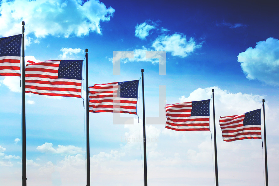 Row of American flags waving in the wind background
