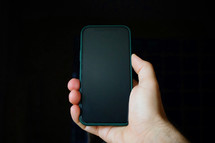 hand holding a smart phone, phone addiction, telework