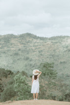 a woman in a straw hat 