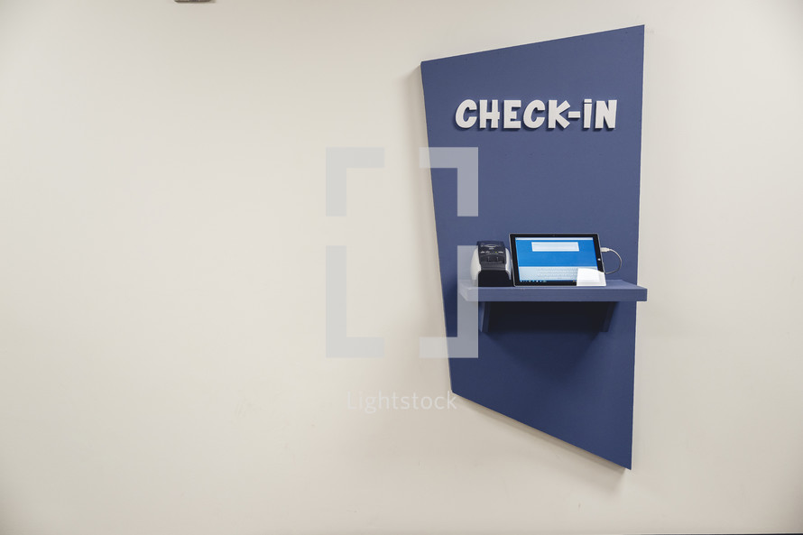 Navy blue child check-in station at church.