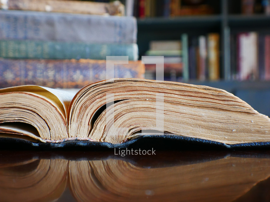 open book on a table in a library 