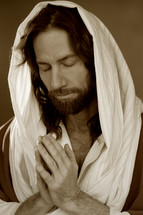 Shrouded Jesus in prayer. 