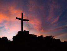 Silhouette of cross against the sunset