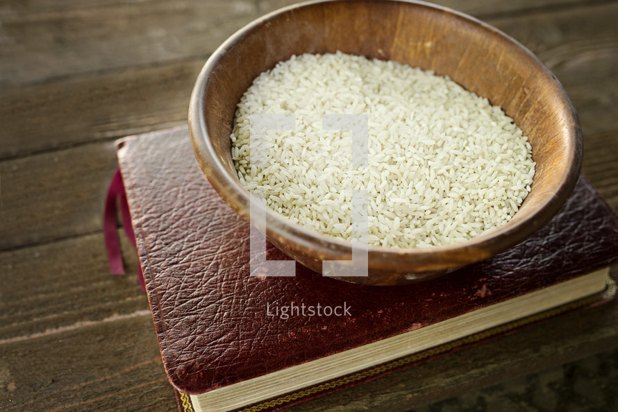 bowl of rice on a bible 