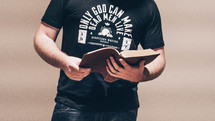 a man reading from a Bible 