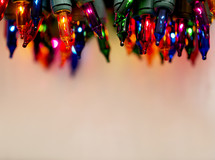 close up of colored Christmas lights border.