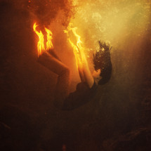 a woman on fire under water 