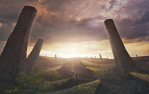 A man walks through a surreal landscape with large towers
