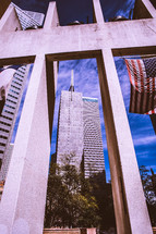 view of city buildings and an American flag 