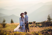 portrait of a bride and groom in a mountain landscape 