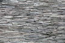 Stacked slate stone wall 