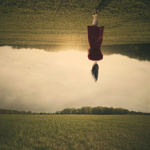 A woman walking upside down 