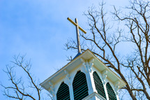 cross topper on a church steeple 