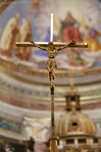 gold crucifix inside a church 