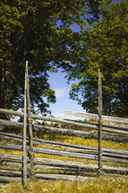 A rustic wooden fence in nature