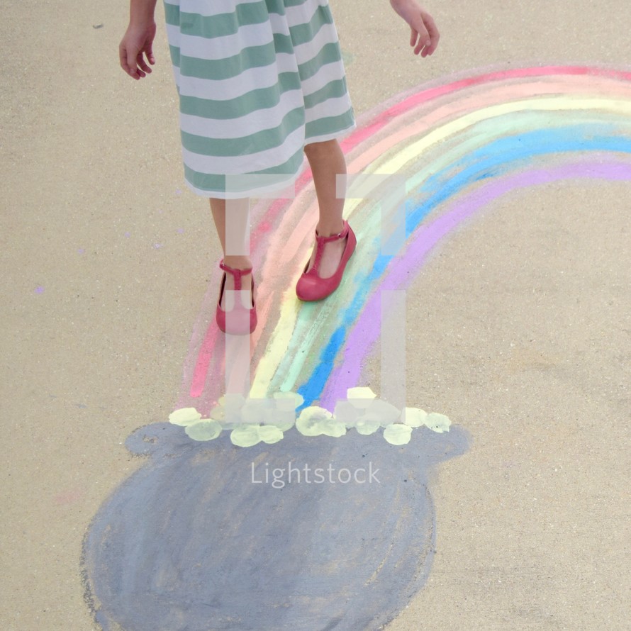 a girl walking towards the pot of gold at the end of a rainbow 