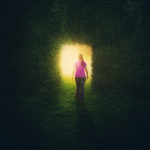 A woman walking into the light 
