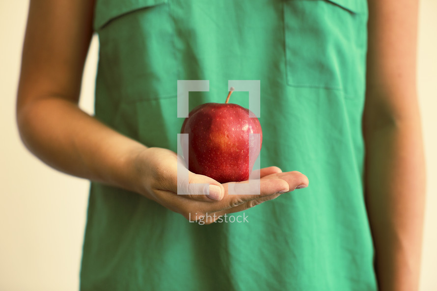 teacher holding an apple 