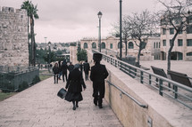 people walking on sidewalks in Jerusalem 