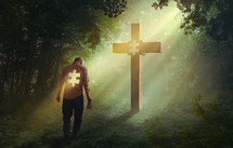 man with a missing puzzle piece standing in front of a cross