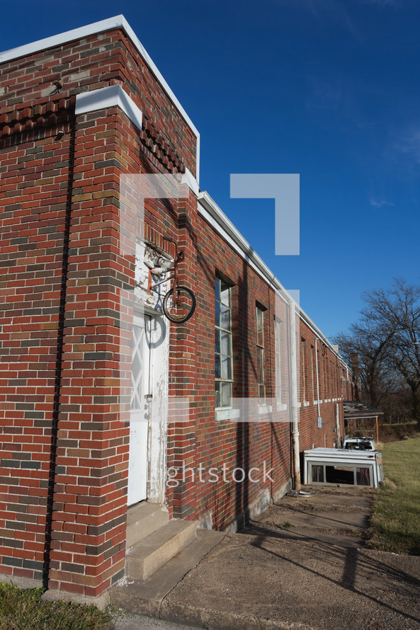 Red brick building with bike decor