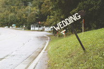 Wedding sign on a hill.