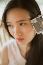 woman holding a camera 