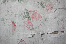 floral pattern on a pealing plaster wall 