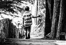a boy walking away 