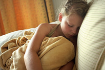 a young child sick in bed