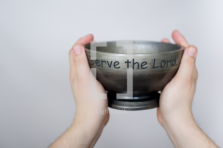 Serve the Lord bowl lifted in the air