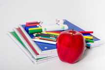 School supplies with an apple.