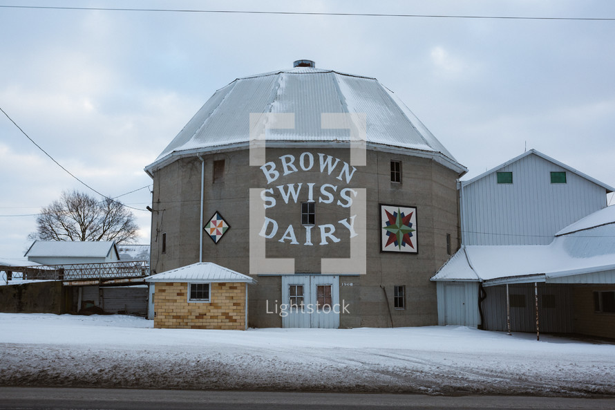 An old dairy barn in snow.
