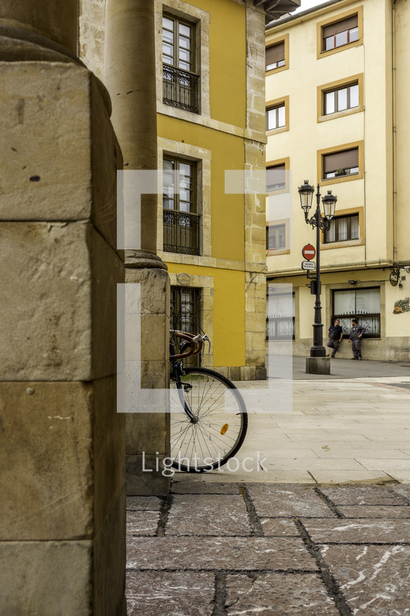 bicycle and yellow buildings in Oviedo, Spain 