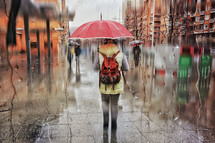pedestrian on the street with an umbrella in rainy days in winter season