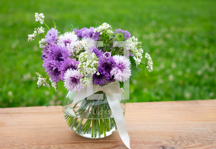purple and white flowers in a vase 