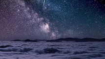 Milky way galaxy starry sky in misty mountains with foggy clouds motion in night nature landscape Astronomy Time-lapse
